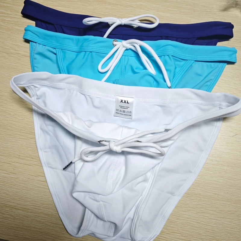 2026New s slender waist men's swimming trunks foreign trade triangle swimsuit European and American new fashion D101