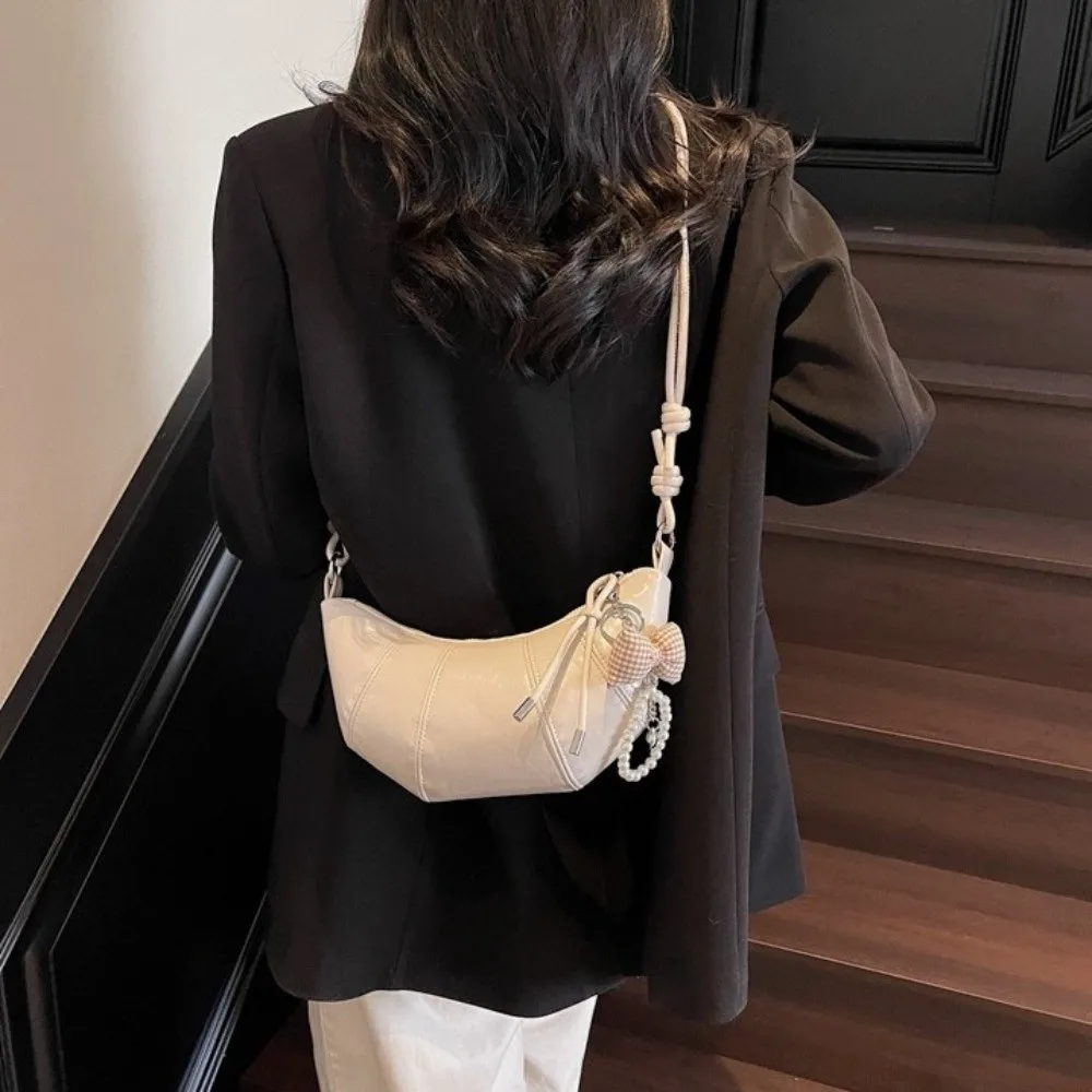 

Elegant Croissant Shoulder Bag Bowknot Pearl Pendant PU Leather Underarm Dumpling Bag Korean Style Solid Color Crossbody Bag