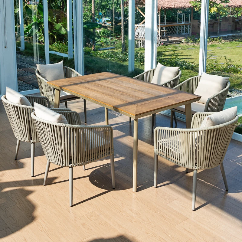 

Outdoor plastic wood dining table and chair combination Open-air terrace Garden rattan chair in yard