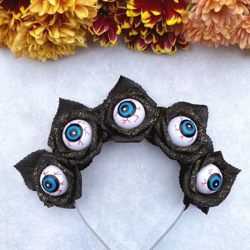Gotycka różana korona kwiatowa - ciemny, elegancki nakrycie głowy z akcentami w kształcie gałek oczu - idealne na Halloween i imprezy maskaradowe