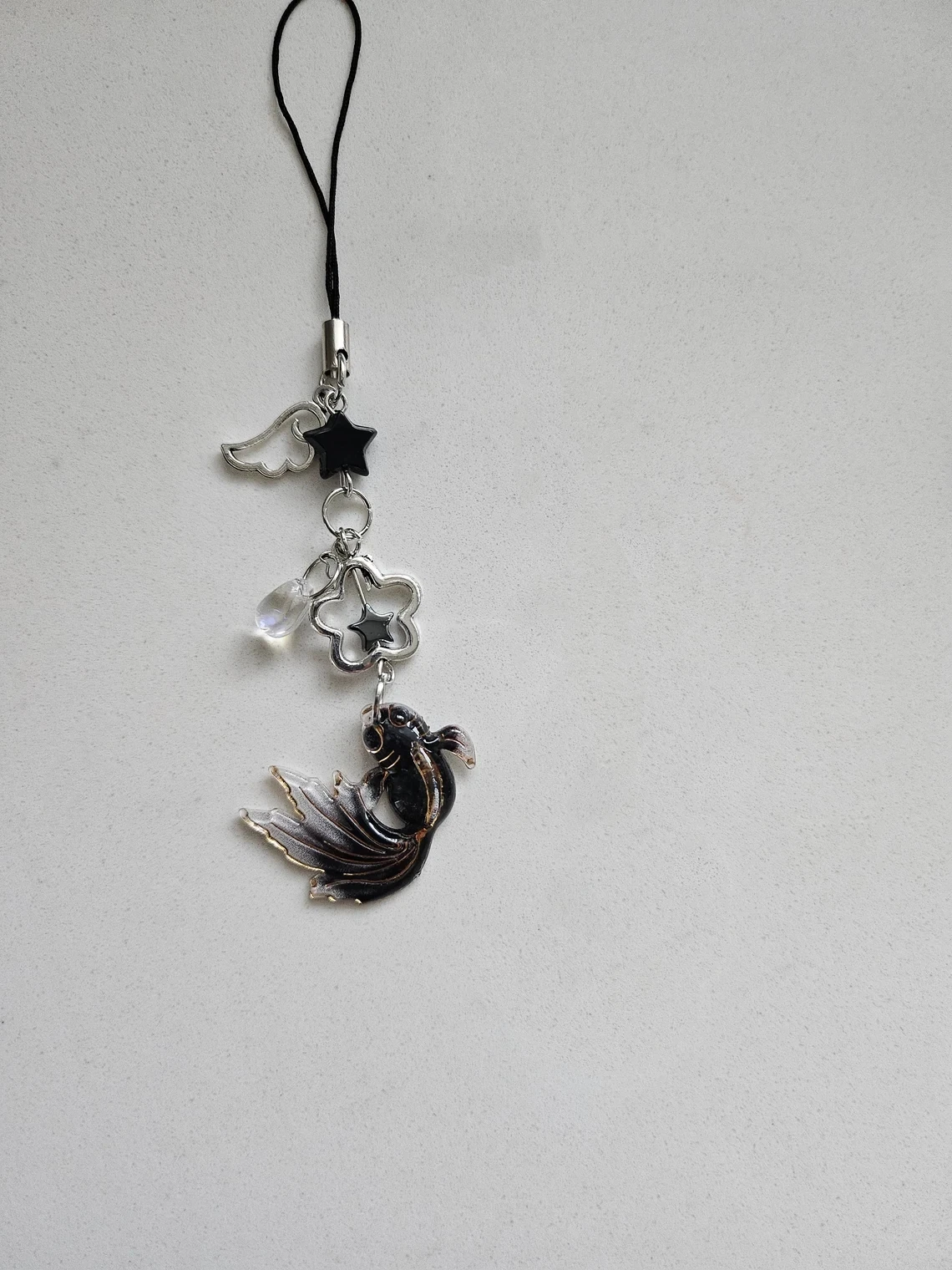 Black and white fish inspired mobile phone pendant