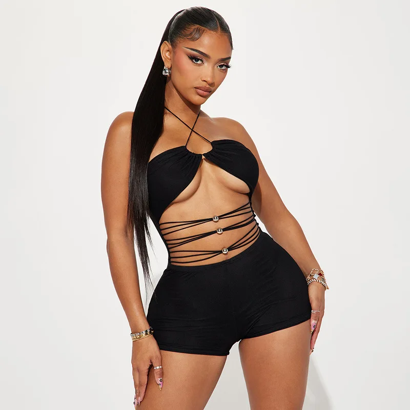 

Europe and the United States women's beads pierced hollow hanging neck tie waist tight shorts jumpsuit woman