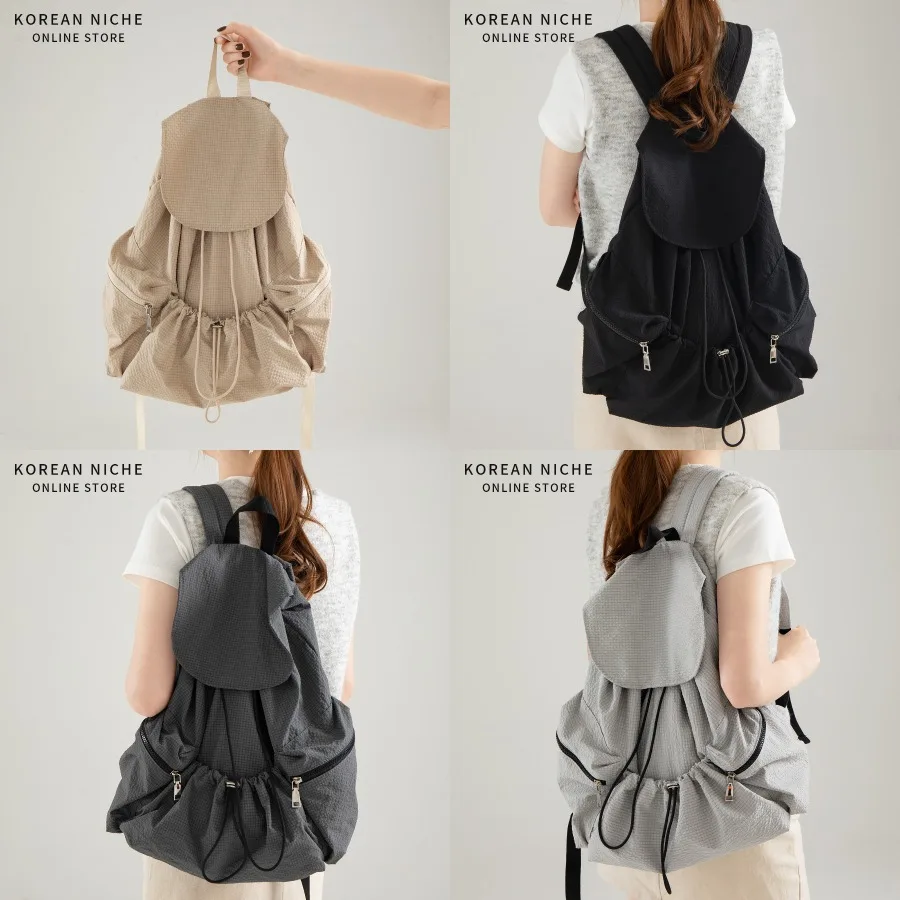 

【New style】New Korean style niche design solid color fashionable all-matching light and large capacity backpack women's casual
