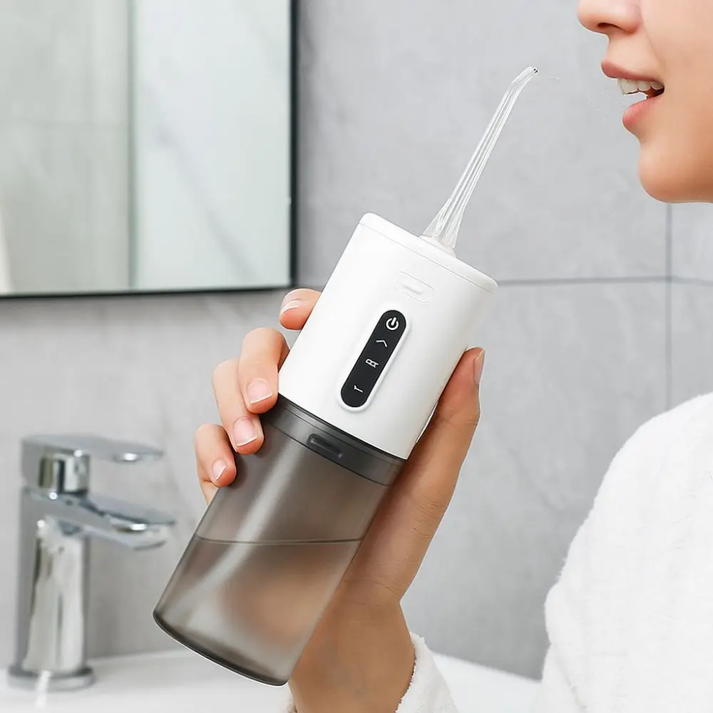 

Профессиональный ирригатор для полости рта с зарядкой через USB, глубокая очистка, портативный очиститель зубов, трехчастотные импульсы, ирригатор для воды, брекеты, чистка