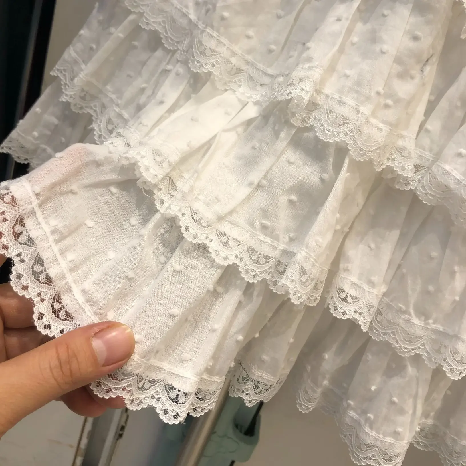 جديد فراشة عقدة الأبيض تنورة قصيرة عالية الخصر ألف خط كعكة تنورة المرأة النقي التطريز المضادة للضوء الطبقات نصف تنورة