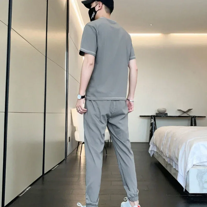 Conjunto de ropa deportiva para hombre, camiseta de manga corta, pantalones Kpop, chándal de gimnasio, trajes deportivos negros, Top de Jogging, al aire libre