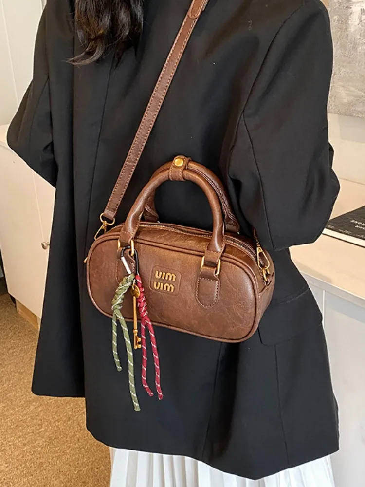 

Luxury designer portable bowling bag female 2025 new fashion all-match one-shoulder small square bag retro messenger bag trend