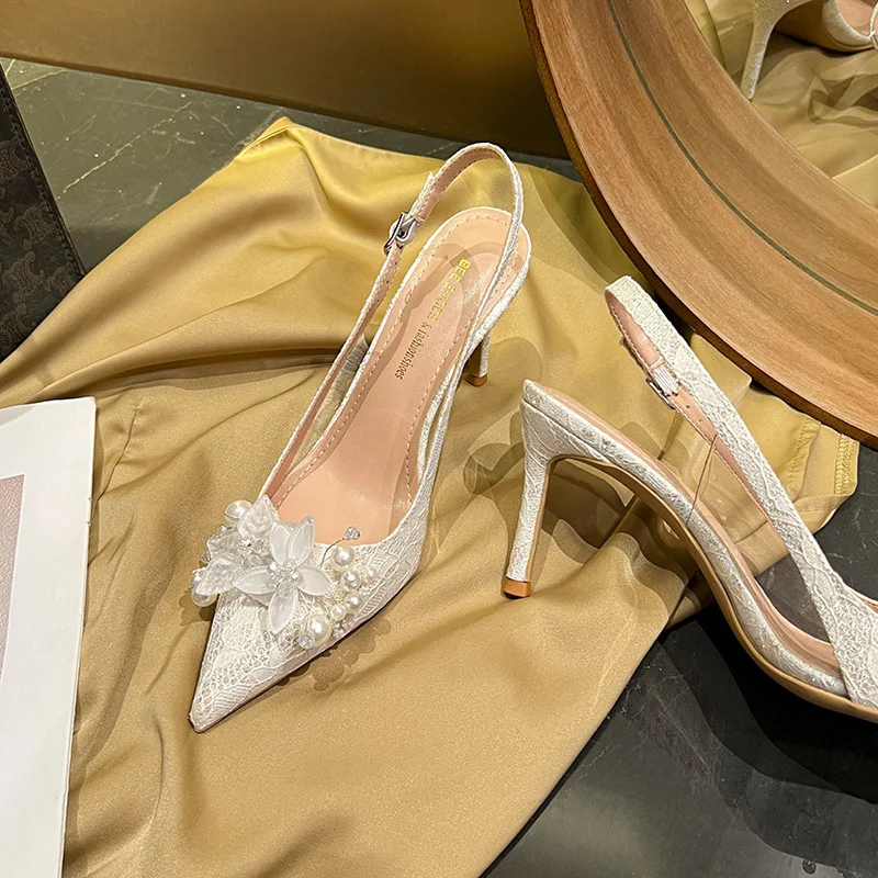 

Summer style high-heeled shoes with thin heels and pointed toes, empty pearl flower white French sandals, wedding shoes