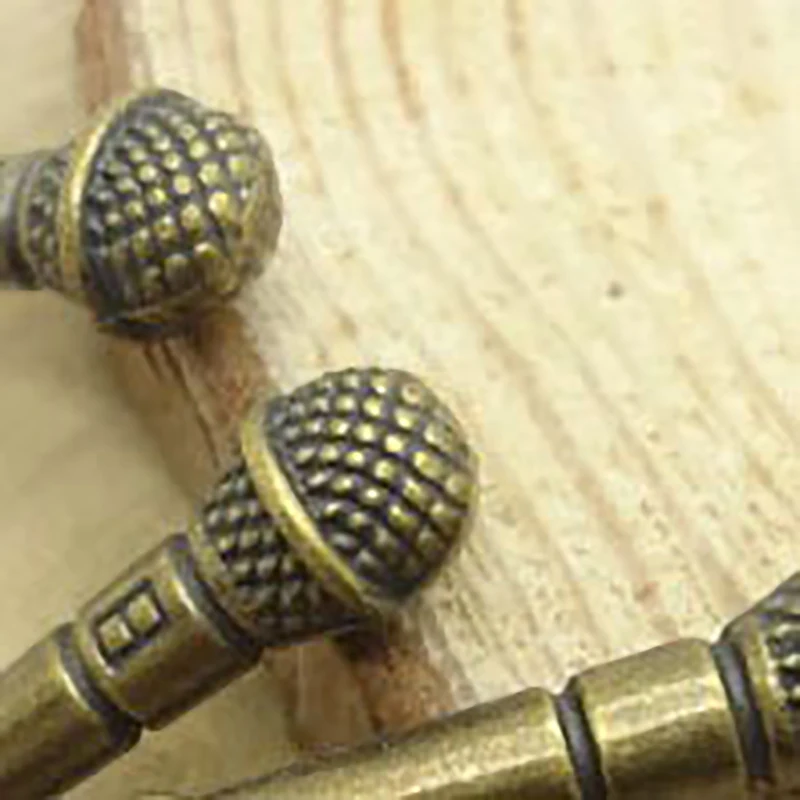 10 Uds casa de muñecas Retro aleación música micrófono colgante simulación estéreo micrófono DIY casa de muñecas decoración juguetes Accesorios