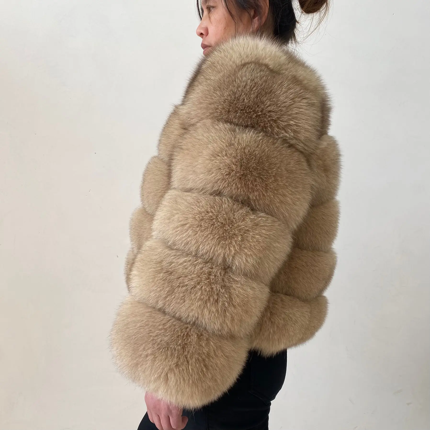 The lady's fashionable natural genuine fox fur women's winter fur coat. Fashionable fox fur natural fur women's coat. Genuine fo