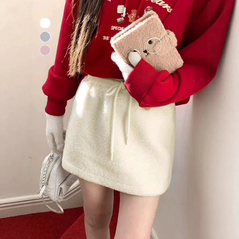 المرأة صوف الضأن تنورة بيضاء مرونة عالية الخصر الحلو عادية الصلبة سميكة أفخم تنورة الخريف الشتاء الكورية ألف خط تنورة قصيرة صغيرة