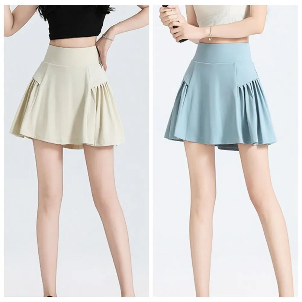 通気性のあるハイウエストプリーツスカート、アンチグレア無地テニスショートスカート、フェイクツーピースフィットネスウェア、スポーツパンツスカート
