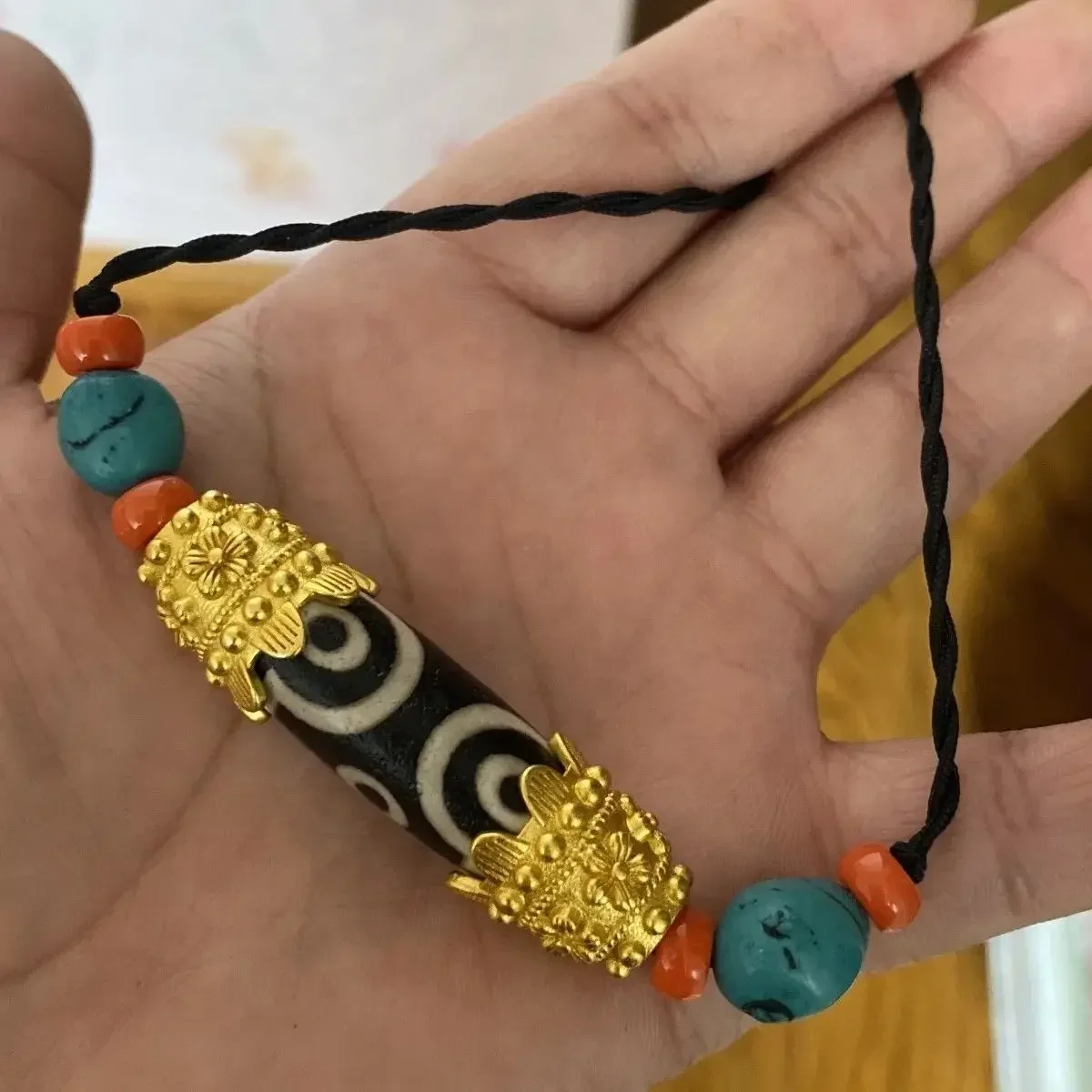 

Тибет Непал импортирует позолоченный дзи, унисекс