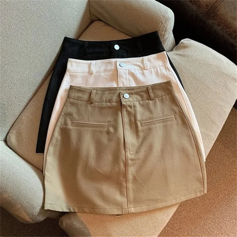 تنانير قصيرة مثيرة للسيدات على الموضة لعام 2025 تنورة غمد ملفوفة على الورك للربيع والصيف عالية الخصر للسيدات غير رسمية تنانير على شكل حرف a