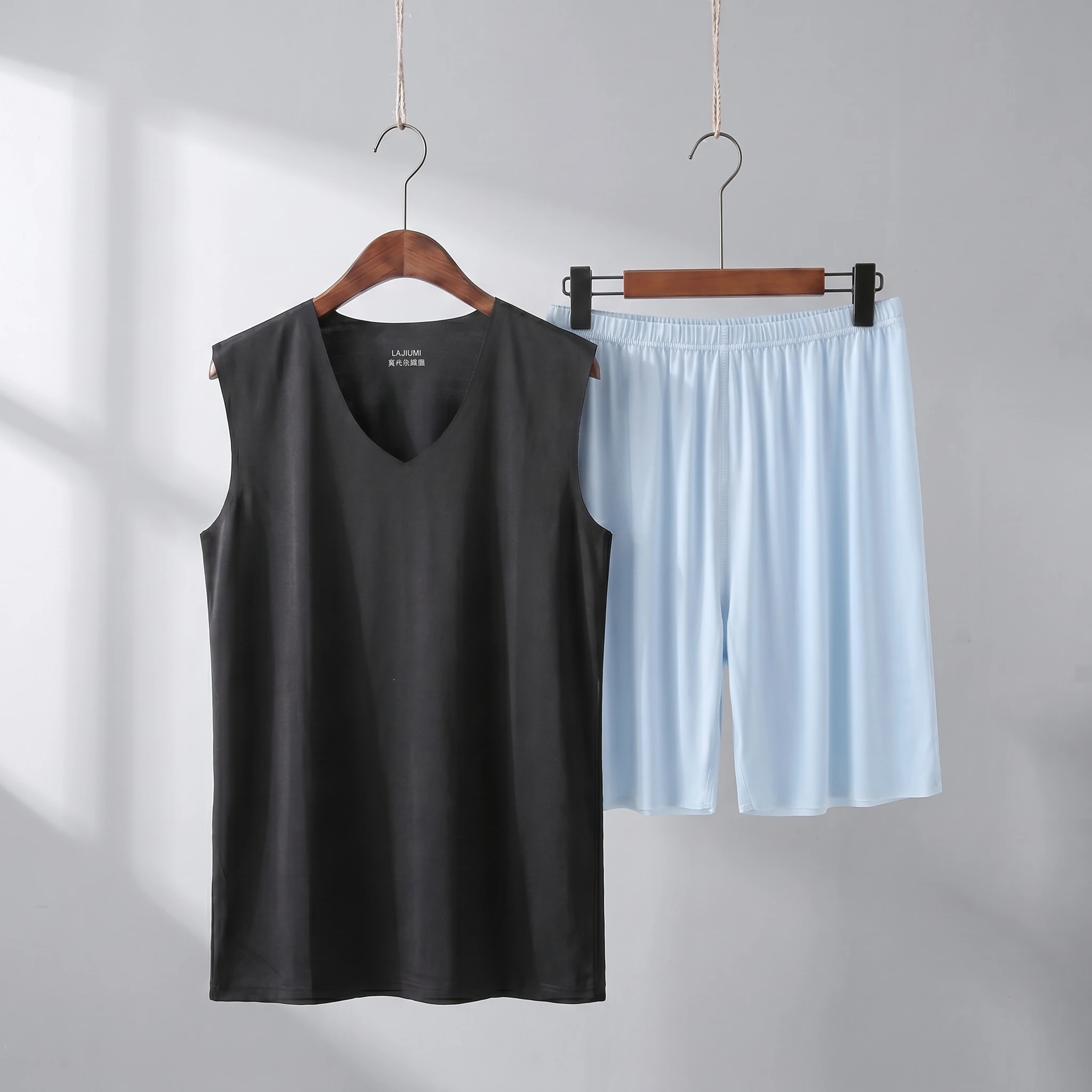 Black vest + light blue shorts