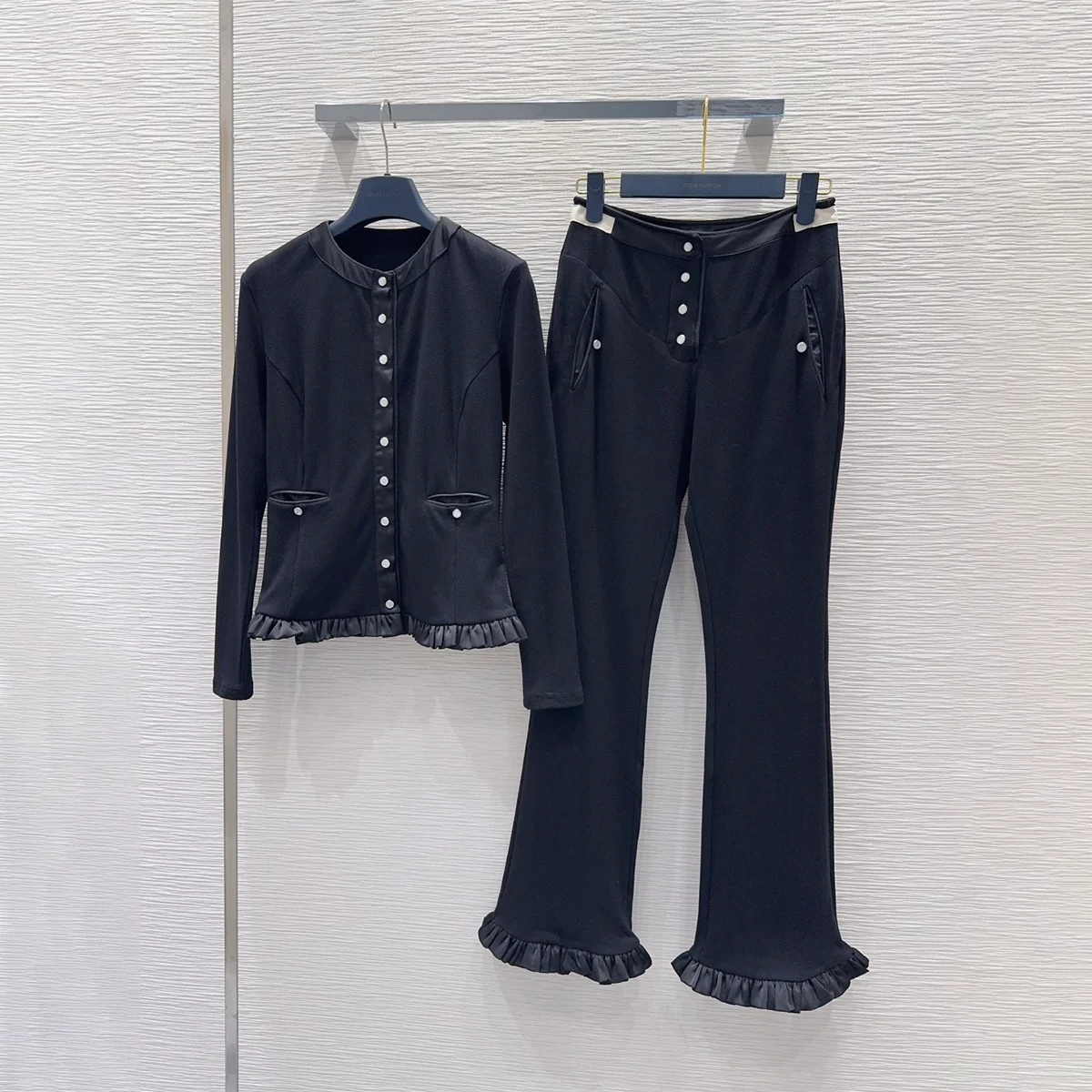 2026 High quality women's black fungus edge long sleeved top with ruffle edge and slightly flared pants two-piece set--202609114