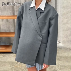 TWOTWINSTYLE Solid Patchwork Pockets Minimalist Coat For Women Lapel Long Sleeve Spliced Button Asymmetrical Coats Female New