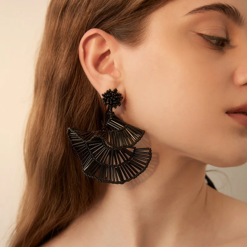 Retro court fan-shaped earrings for women, exuding a refined and elegant charm. Delicate fringes on a long design, making it an