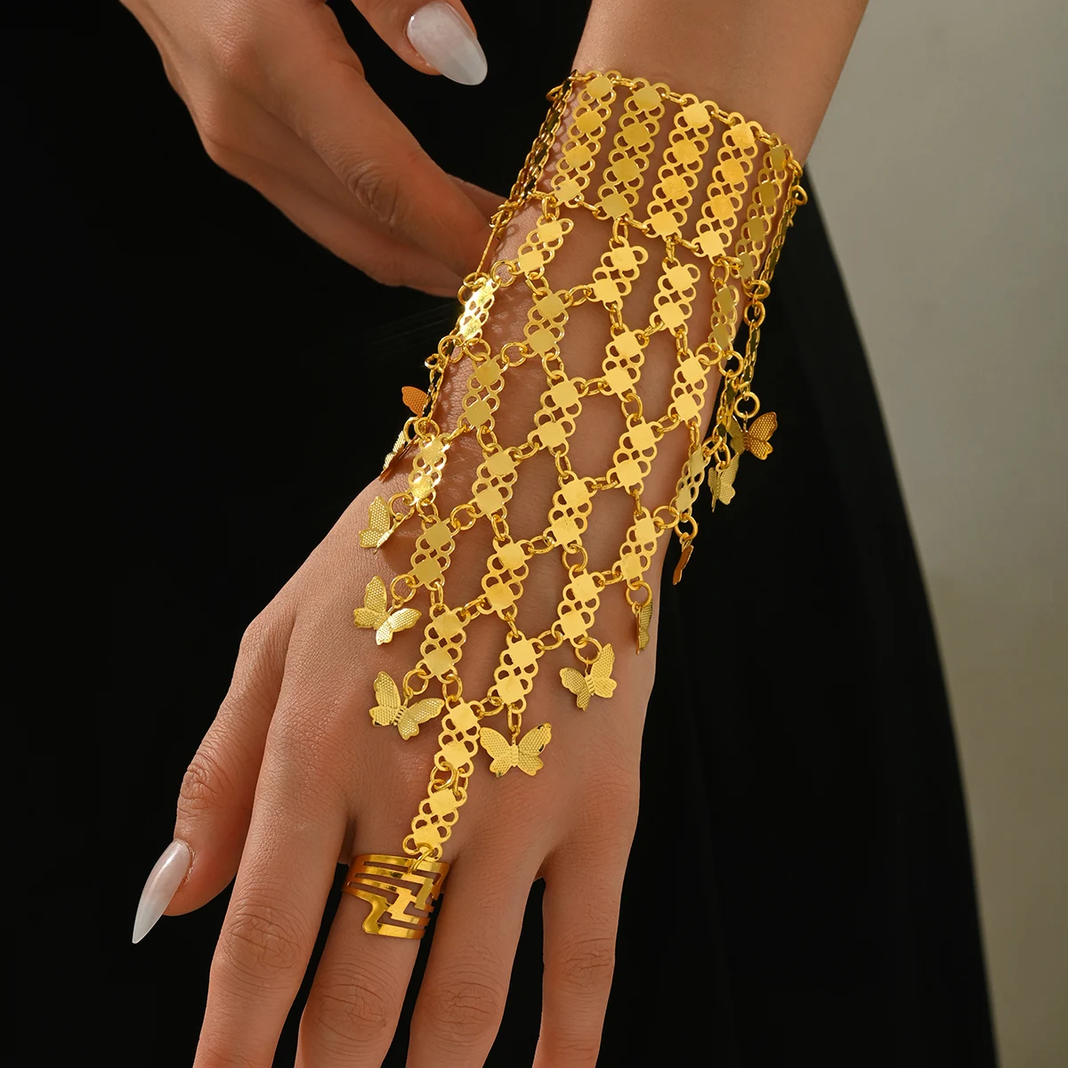 A Golden And Simple Design Butterfly Pendant Bracelet As A Performance Accessory For Ethnic Dance.