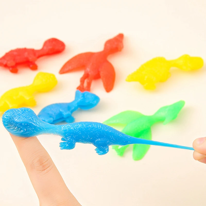 5Pcs Creative Finger Slingshot Dinosaur Stress Relief Toys Novelty Funny Slingshot Dinosaur Lala Le Halloween Prank Toys