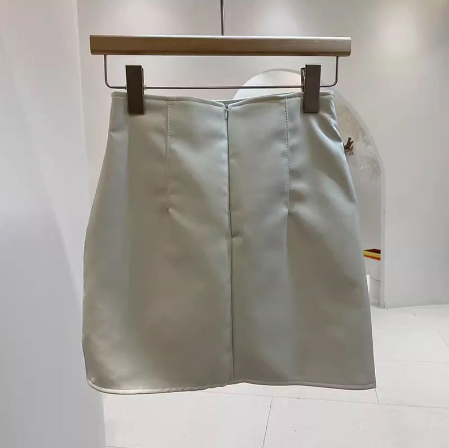 Nueva moda Otoño/Invierno Sexy cintura alta PU Color sólido Slim Fit cintura elástica por encima de la rodilla Mini falda para mujer, 3 colores