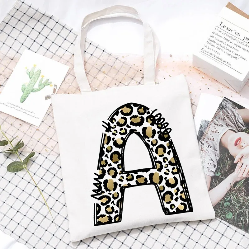 

Leopard Print 26 Letter Creative Tote Bag Handbags for Women Large Capacity Shopping Bag Cartoon Tote Bag with Letters