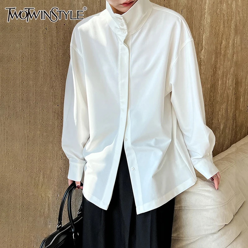 

TWOTWINSTYLE Solid Spliced Button Minimalist Shirts For Women Lapel Long Sleeve Loose Temperament Blouse Female Fashion Style