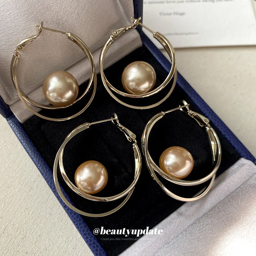 Double Ring Hoop Earrings Featuring Suspended Central Pearl Charm Delivering Modern Geometric Aesthetic For Sleek Office Attire