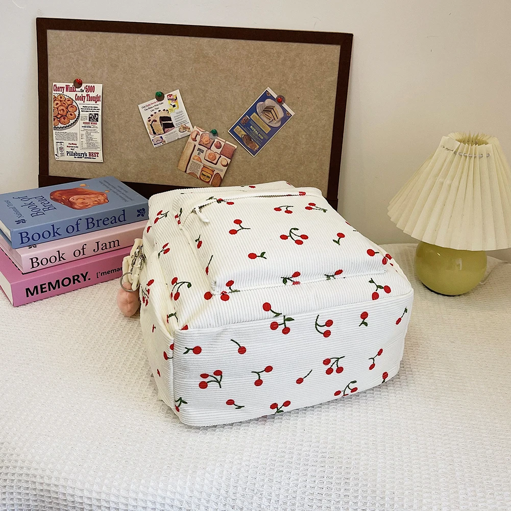 กระเป๋าหนังสือผ้าลูกฟูกน่ารักลายเชอร์รี่ กระเป๋าเดินทางสำหรับผู้หญิง สายสะพายปรับได้ กระเป๋าเรียนแบบมีซิปสำหรับทำงาน ช้อปปิ้ง และไปโรงเรียน