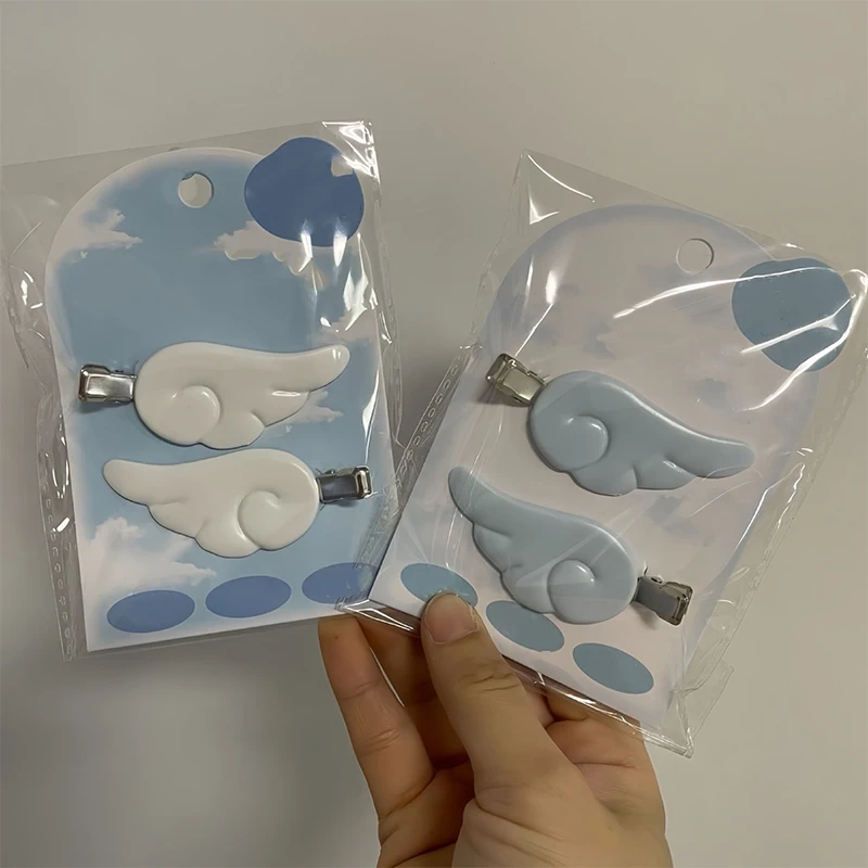 Cute and sweet white angel wing hair clip with Japanese-style side design and anime-inspired bangs.