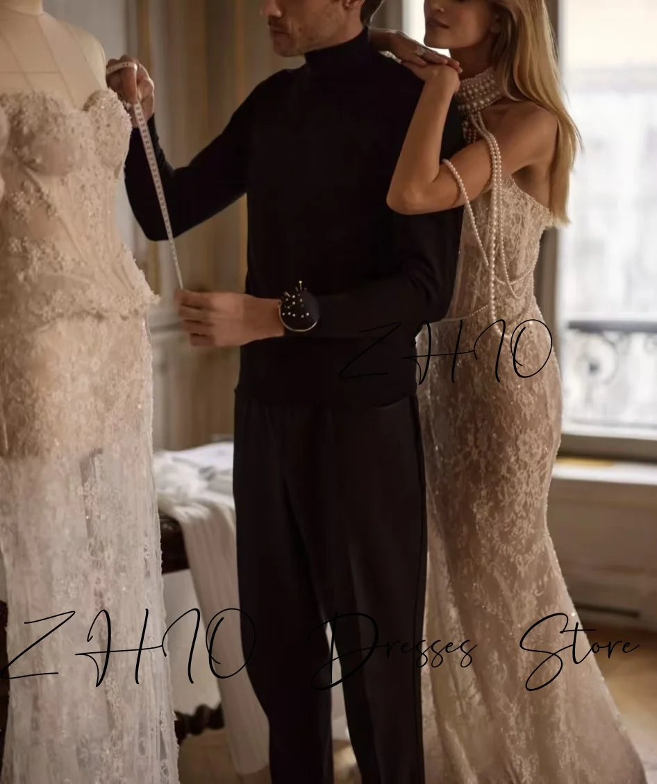 ชุดแต่งงานหรูหรา ZHIO ประดับมุก คอร์เซ็ทแบบผูกคอ ทรงเมอร์เมด ชายกระโปรงยาวลากพื้น สีไอวอรี่ ผ้าลูกไม้ ชุดราตรีเจ้าสาว สามารถสั่งตัดได้