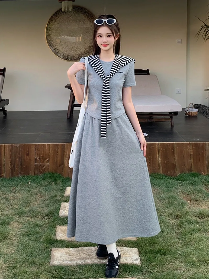 

Летний повседневный комплект для женщин больших размеров: полосатая юбка миди с открытыми плечами и модный дышащий топ с коротким рукавом (двойка)