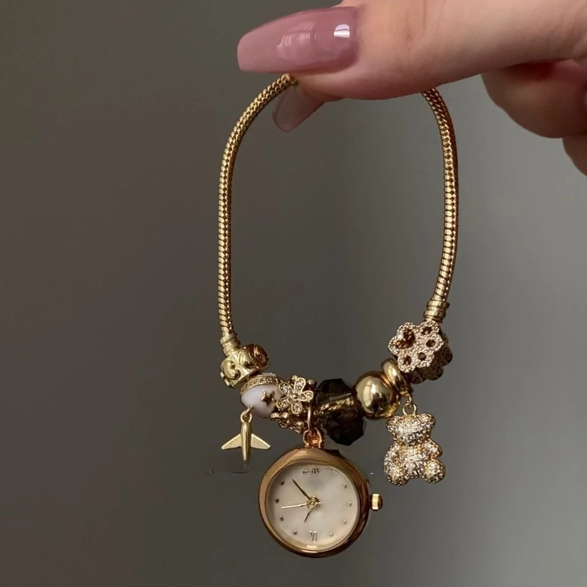 

Niche high-end bracelet bear plane zircon combination gold women's watch