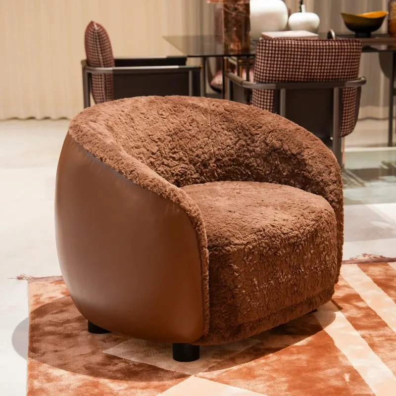 Luxury upholstered round lounge chair with soft plush fabric and leather frame for home decor