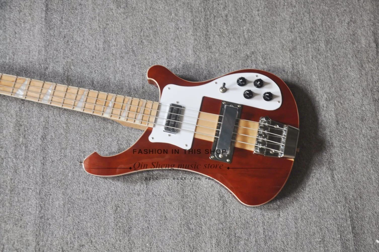 4 string Red brown guitar, fixed bridge, maple neck through the solid body, white pickup board, maple fretboard