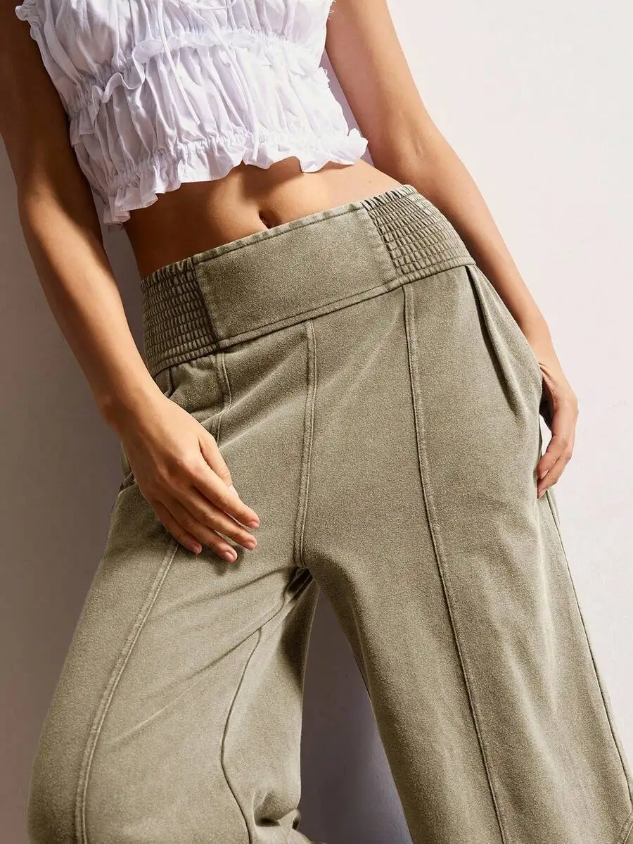 

Женские однотонные трикотажные брюки свободного кроя с широкими штанинами, эластичным поясом и карманами