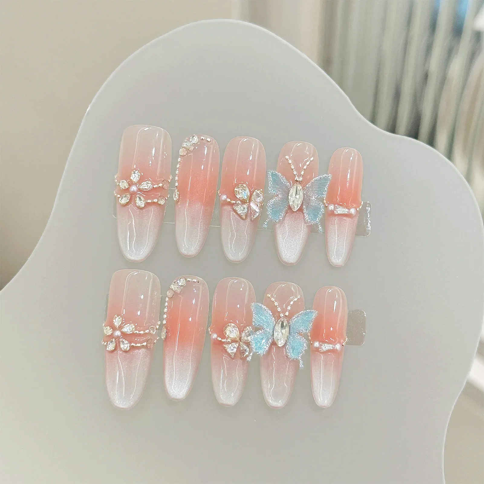 

10Pcs Long Oval Shaped Fake Nails Blush Pink Handmade Press On Nails Shiny Diamond Butterfly Flower Designs False Nail for Girls