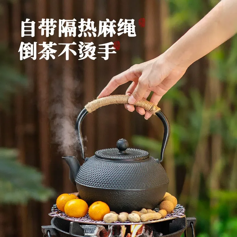 Cast iron teapot boils special tea around the stove