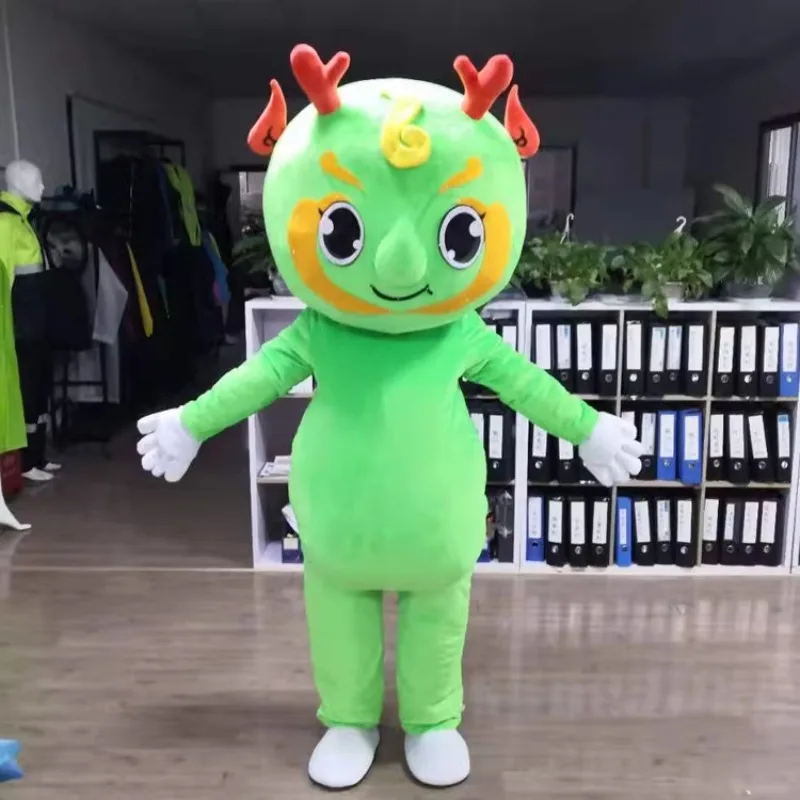 L'uomo dinosauro verde indossa copricapo peluche puntelli bambole dei cartoni animati abbigliamento per bambole abbigliamento per burattini