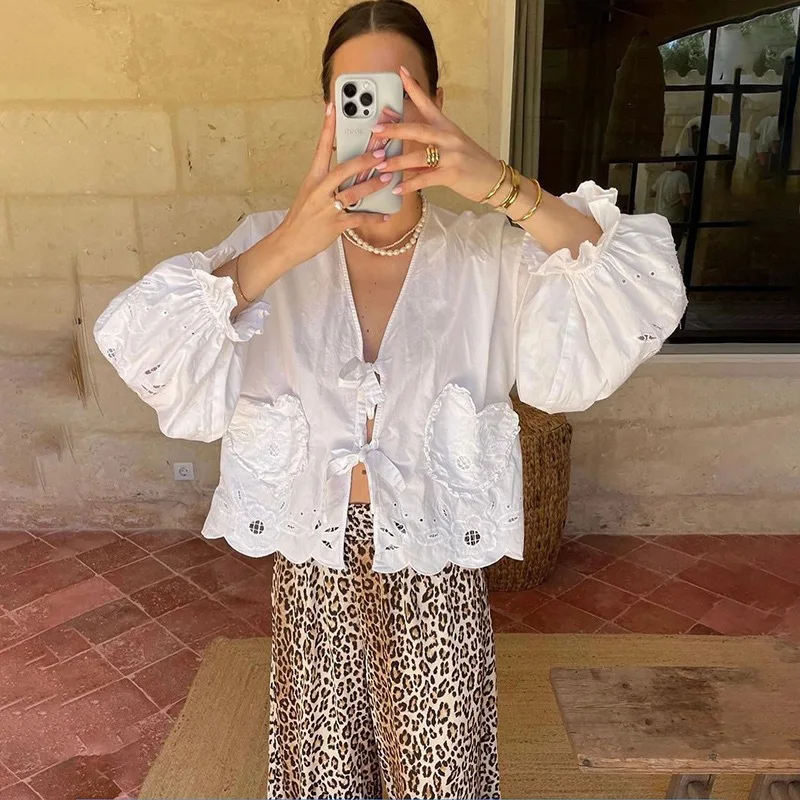 

【Gift Free】French Chic 2026 Early Spring Lazy Heart Pocket Bell Sleeve V-Neck Lace-Up Hollow Floral Shirt for Women