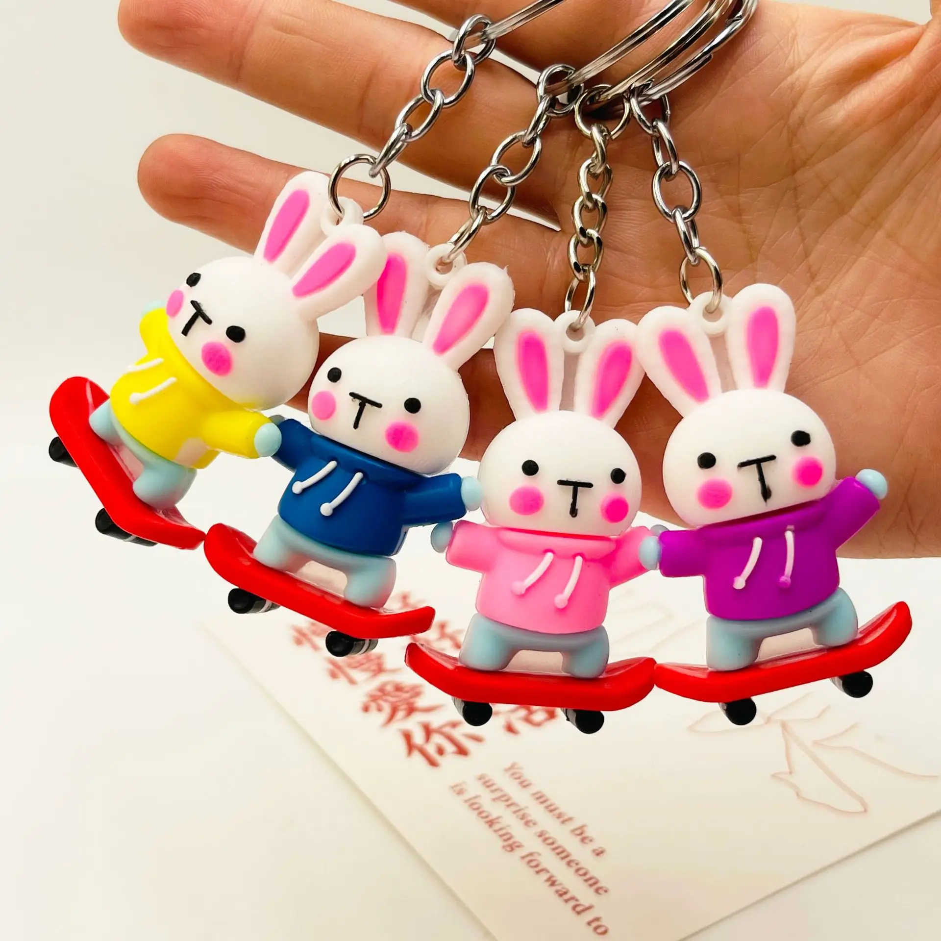 Cute rabbit keychain personality trend skateboard rabbit doll keychain bag pendant activity gifts