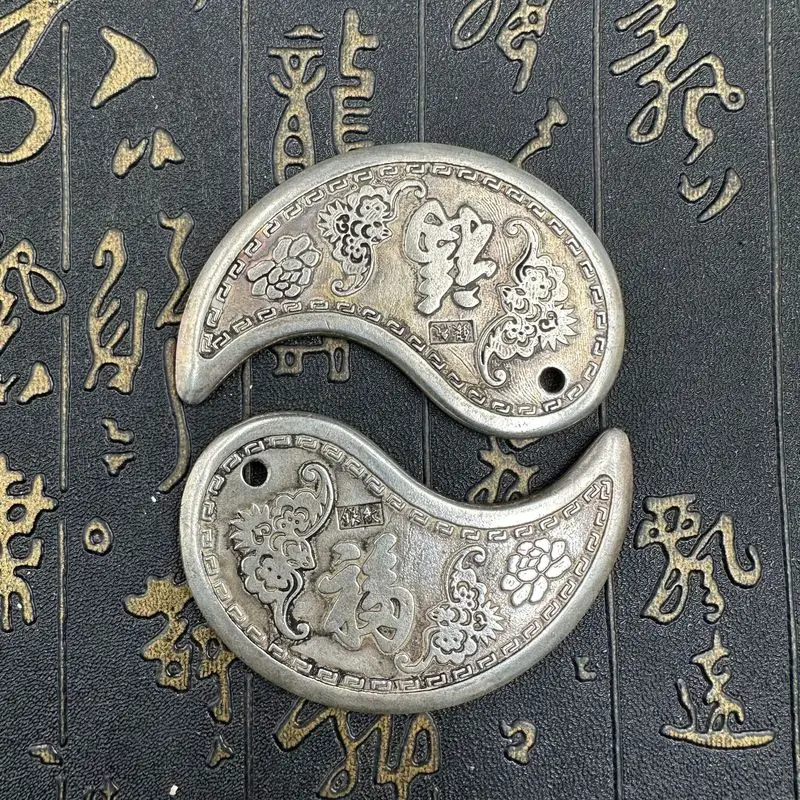 Antiqued half-moon-shaped scraper with the characters 