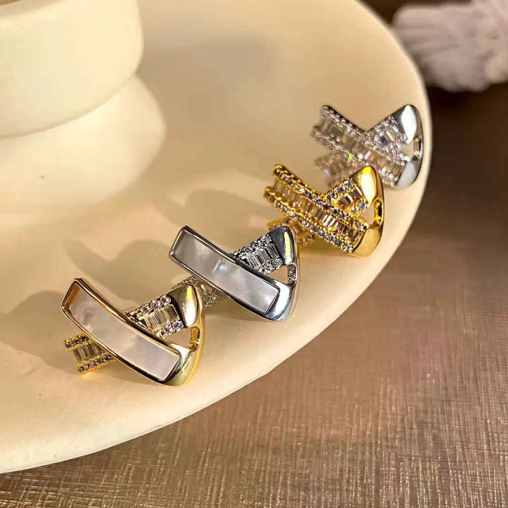 

X letter design earrings. Cross design inlaid with shiny zircon, fashionable and high-end women's earrings. Christmas gift