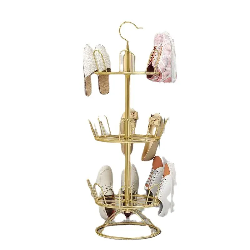 

Wrought iron rotating shoe drying artifact