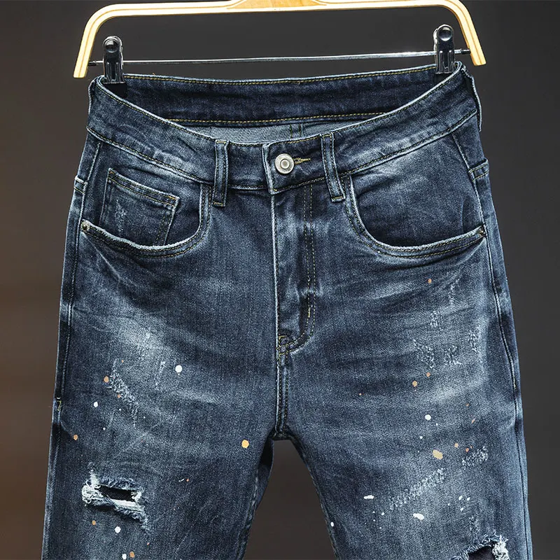 Jeans sobek untuk pria baru 2024 model jalanan kasual desain jahitan elastis slim fit sepeda motor vintage panjang