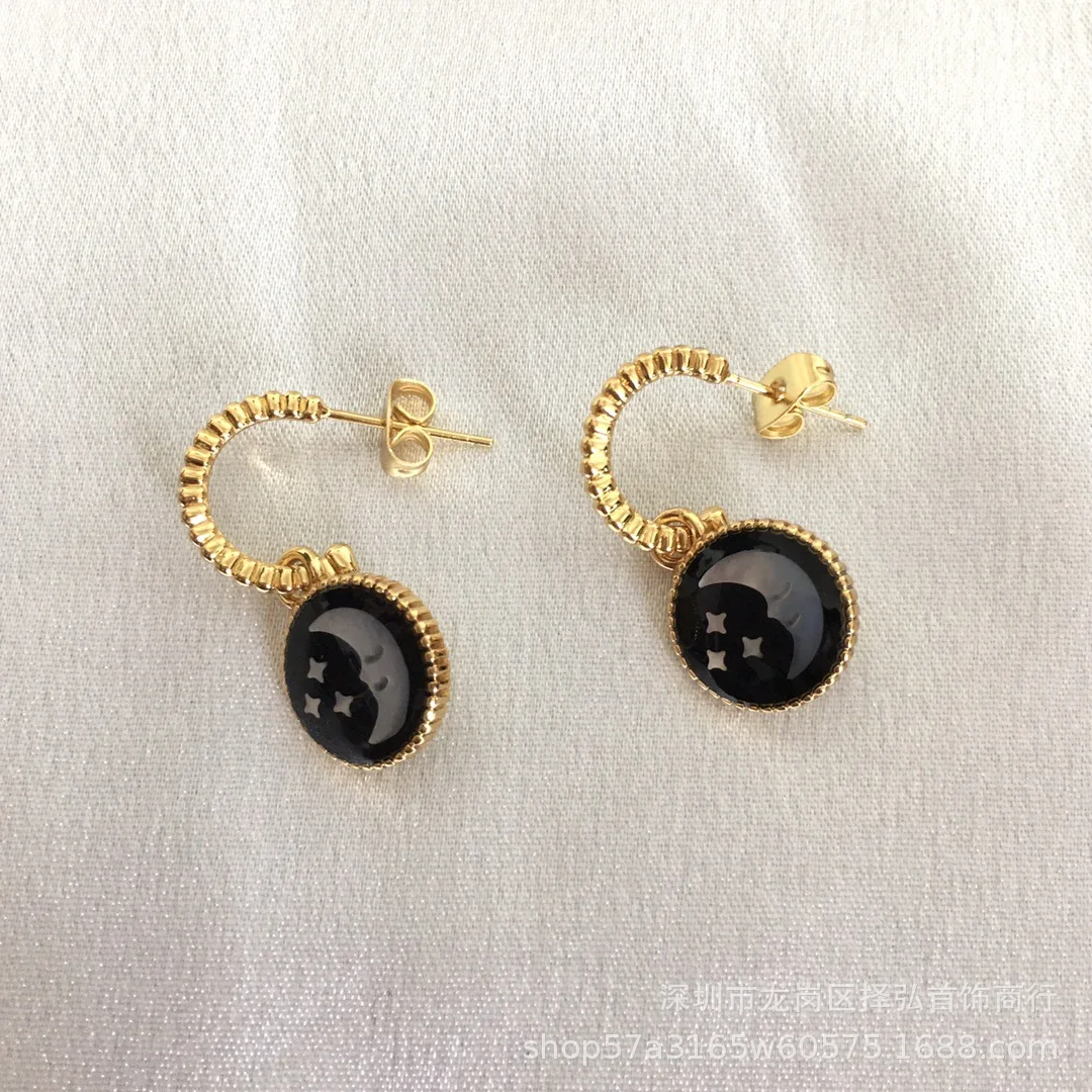 حار أزياء أوروبا القمر الأسود الذهب ستار أقراط المرأة سحر المجوهرات حزب المدرج العصرية