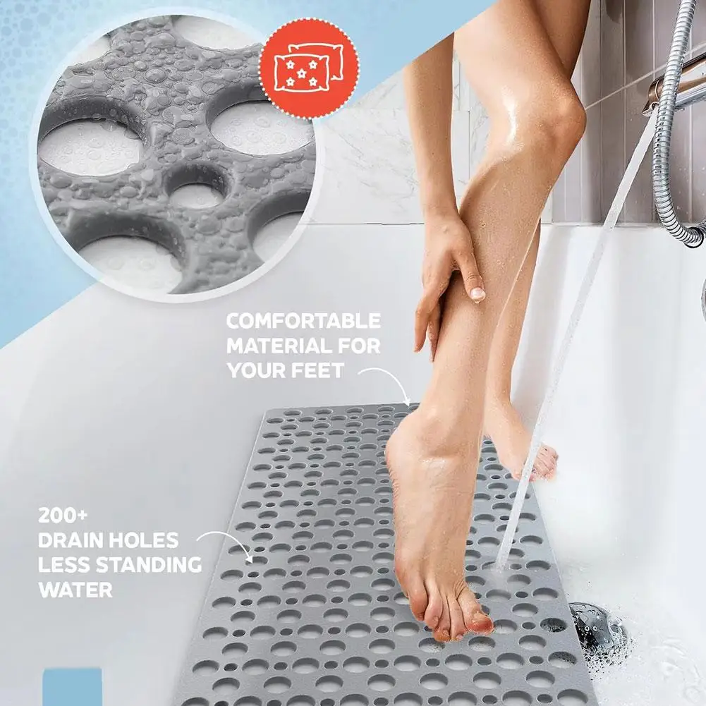 White 3D anti-slip bath mat with suction cups and massage bumps on wet floor.