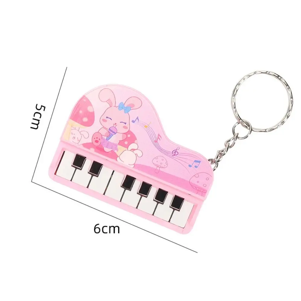Cor sólida mini piano eletrônico chaveiro urso vertical mini piano chave pingente adorável instrumento musical audível piano chaveiro