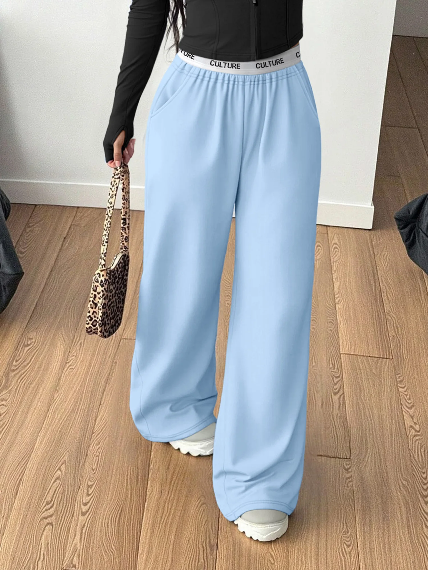 Zwarte loungebroek met wijde pijpen voor dames, ontspannen pasvorm, "CULTUUR" tailleband, zachte casual broek