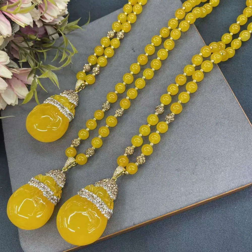 

New synthetic beeswax lucky bag pendant for women, simple and luxurious ladies' clothing, sweater chain jewelry